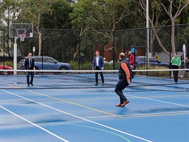 Game of pickleball at the official opening of Carlson Reserve multi-purpose courts