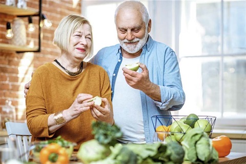 Older people eating apples