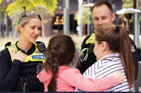 Police officers talk to residents