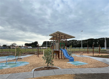 Mount Waverley Reserve playpace inclusive carousel, monkey bars, slides and play units 2024