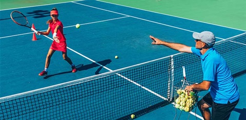 Tennis player hitting the ball