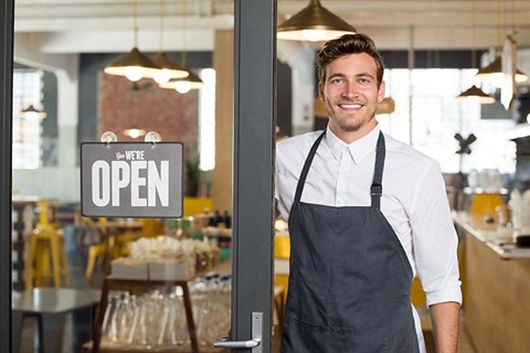 Cafe owner opening cafe