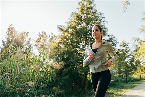 Image of woman running on path